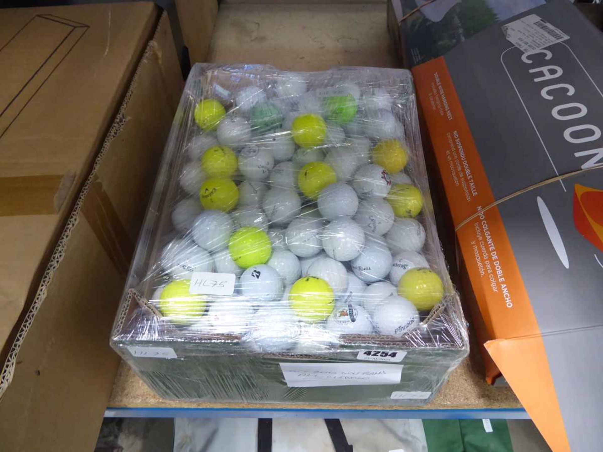 Box containing a quantity of assorted golf balls