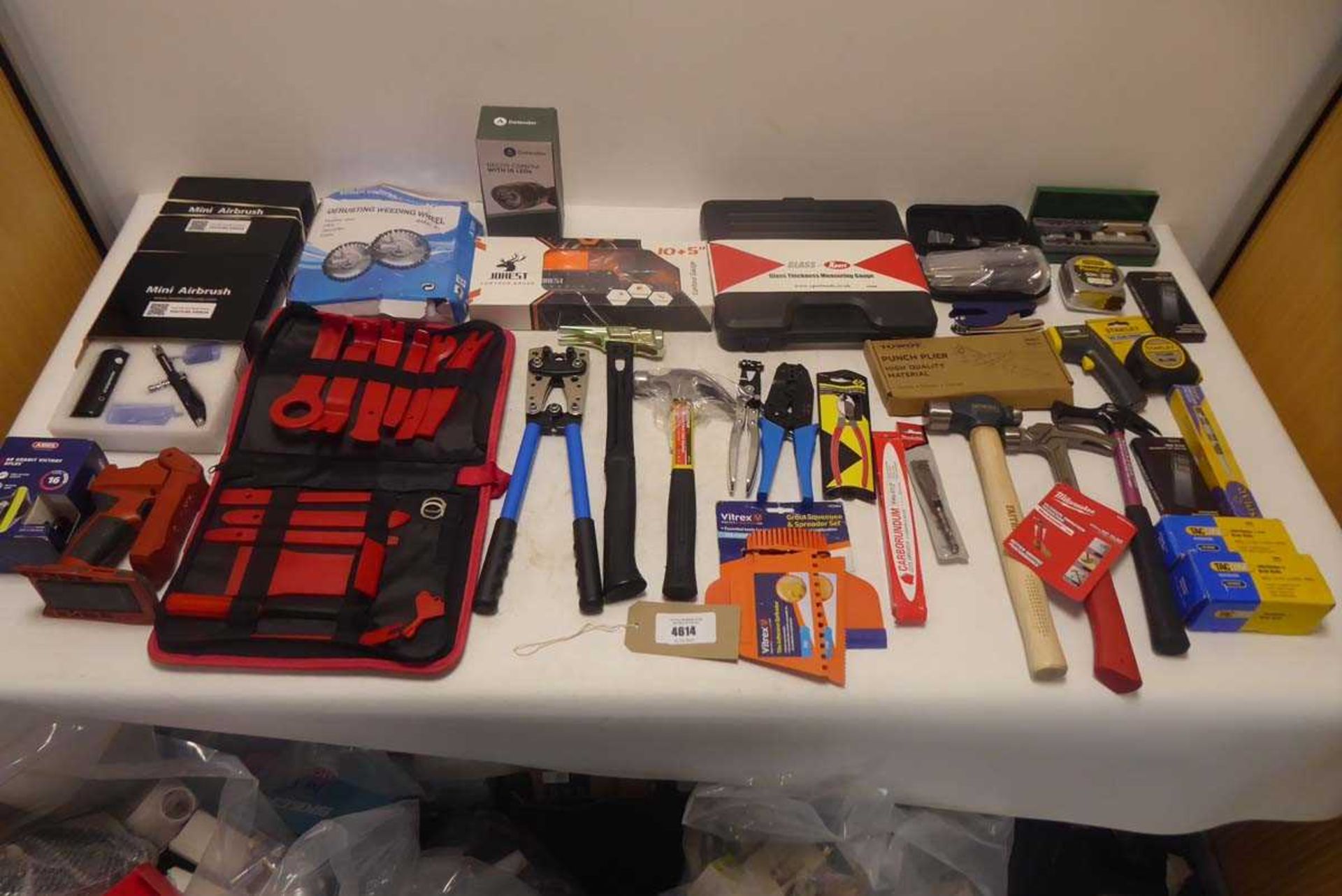 +VAT Selection of tools to include a Milwaukee hammer, Tacwise staples, a glass thickness