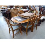 Extending elm dining table plus six matching chairs to include two carvers