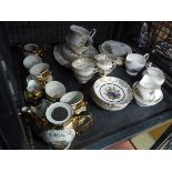 Cage containing lusterware tea service plus fruit patterned china