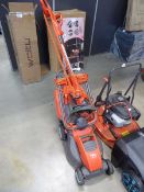 Orange Flymo 240V lawnmower and strimmer
