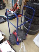 Blue Goodyear tyre rack with multiple tyre covers