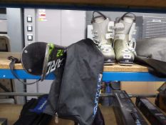 2 white skiing boots by Alomon with a pair of Blizzard skis, Magnum 7.2 with bag