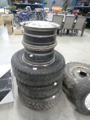 Three Land Rover steel 16" wheels with tyres plus two 16" steel wheels without tyres