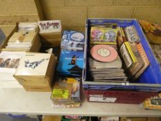 Tabletop of assorted vinyl singles including Vancougers, Parachute, Ten Benson, Skinjobs, Crash,