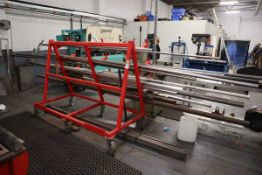 Red welded steel cantilever rack together with the remaining stocks of box section and tube