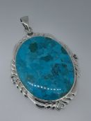 Silver and Reconstituted Turquoise Oval Pendant