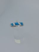 Silver and reconstituted turquoise ring