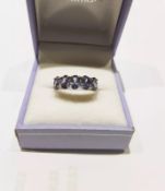 A Silver 5 Stone Tanzanite Half Hoop Ring With Valuation
