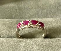 A Silver Four Stone Ruby & Diamond Ring With Valuation