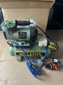 Holding mini air compressor model CP103