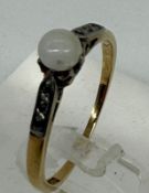 An 18ct yellow gold pearl style ring, approximate weight 2.4g
