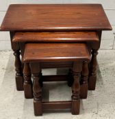 An oak nest of tables (H66cm W60cm D33cm)