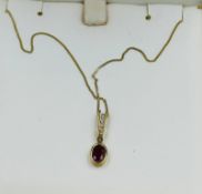 A 9ct gold pendant and fine neklace
