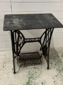 A Singer sewing machine table with wooden top (H73cm W67cm D42cm)