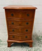 A Yew veneer four drawer bedside (H62cm W40cm D35cm)