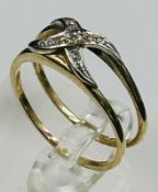 A double crossover diamond ring, approximate weight 2.3g and size P
