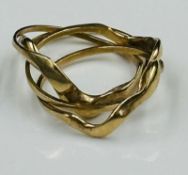 An Arabian gold puzzle ring with an approximate weight of 3.3g and size K