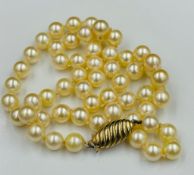 A pearl necklace with 9ct gold fastener