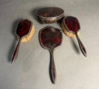 A silver and tortoiseshell dressing table, hallmarked for Birmingham, to include two brushes,