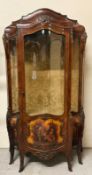 A Bombe front display cabinet, French style with ormolu mounts and painted panel front of classic
