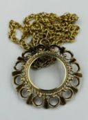 A 9ct gold chain and coin mount, approximate weight of 16.7g