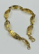 An Egyptian gold bracelet with an approximate weight of 7.6g