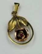 A 9ct gold rose themed pendant with ruby, approximate weight 2.2g