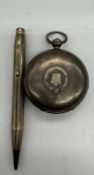 An AF silver pocket watch (A.W.Co Waltham) along with a silver pencil marked 900.