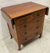An Edwardian mahogany chest of drawers with drop sides (Open H78cm W100cm D51cm)
