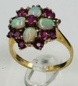 A 9ct gold opal and ruby ring, approximate size O and weight 3.9g