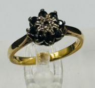 An 18ct gold sapphire and diamond ring, approximate weight 3.6g and size L.5