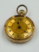 A 14ct gold Ladies pocket watch with floral decorated face and case, approximate weight 27g
