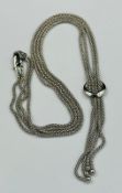 A 9ct white gold two strand necklace, approximate weight 8.6g