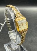 An 18ct gold Orlux ladies watch on expandable metal bracelet