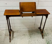 A fruitwood reading table with central folding easel (H70cm W96cm D30cm)