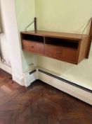 A teak ladderrack floating wall unit