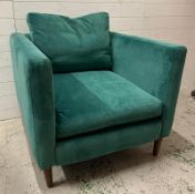 A contemporary cobalt blue upholstered arm chair