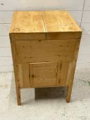 A pine wash stand opening to cut outs for jugs, bowls etc (H74cm W49cm D46cm)