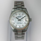 A Mid Size Rolex Oyster Perpetual date-Just watch. Model No 178274 Serial No 1542V493
