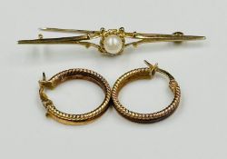A 9ct gold brooch with central pearl along with a pair of 9ct gold earrings, approximate total