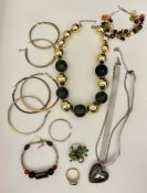 A selection of vibrant contemporary costume jewellery including multi gemmed bracelets, beaded