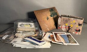 Two albums of vintage postcards and a quantity of loose