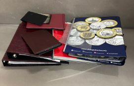 A selection of empty coin collectors albums