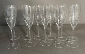 Eleven champagne flutes with spiralised etched pattern