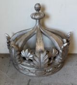 A silver painted wall hanging decorative sconce in the form of a crown