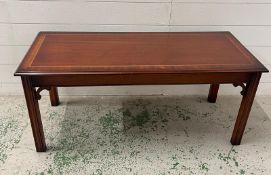 A reproduction coffee table. L105cm W45cm H46cm