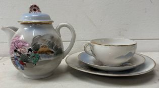 A Japanese Kutani trio of teapot, cup and saucer and a plate