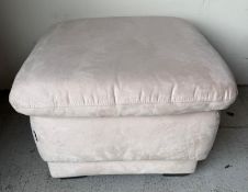 A square puffer foot stall upholstered in a beige fabric by Nicoletti