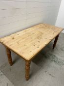 Pine dining table on turned supports H77cm D76cm W168cm